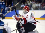 Goalie Martin Brodeur leads his team to a victory over Team USA at the 2002 Olympic Winter Games in Salt Lake City. Team Canada won 5-2 over Team USA.  (CP Photo/COA/Andre Forget).