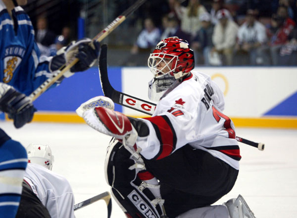 Team Canada goaltender Martin Brodeur makes a save during the game against Finland Feb. 20, at the 2002 Olympic Winter Games in Salt Lake City. The final score was 2-1. (CP Photo/COA/Mike Ridewood).
