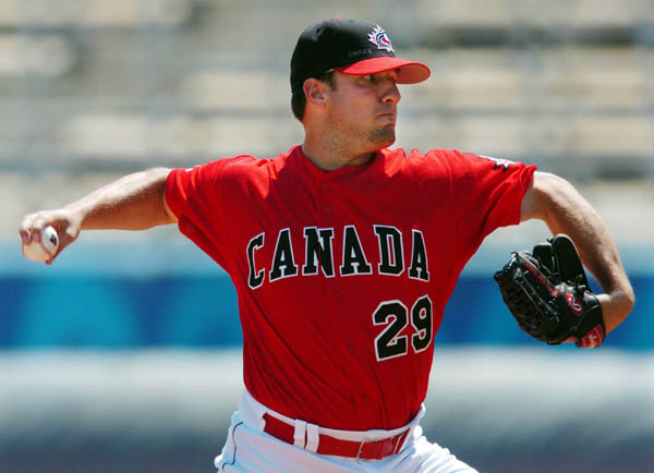 Canadian pitcher Jason Dickson throws against Italy during Olympic Baseball action at the 2004 Summer Olympic Games in Athens, Greece, Monday,  August 16, 2004. (CP PHOTO 2004/COC/Andre Forget)