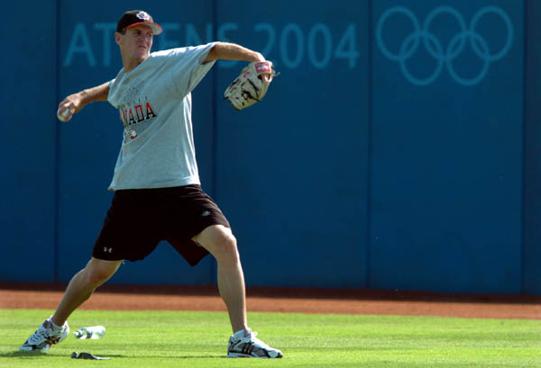 Aaron Mears, pitcher on the Canadian Baseball team throws during a team practice at the Athens 2004 Summer Olympic Games August 12, 2004. (CP PHOTO 2004/Andre Forget/COC)