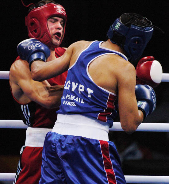 Trevor Stewardson of Medicine Hat, Alberta fights against Ahmed Ismail of Egypt during the Athens 2004 Summer Olympic Games August 19, 2004. Stewardson did not advance. (CP PHOTO 2004/Andre Forget/COC)