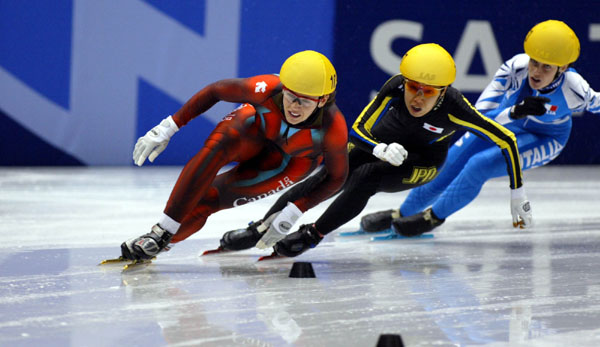 Canadian short track speed skater Isabelle Charest is followed closely by a Japanese and an Italian skaters  during the Women's 500 metre, Feb. 16, at the 2002 Olympic Winter Games in Salt Lake City. (CP Photo/COA/Andre Forget).
