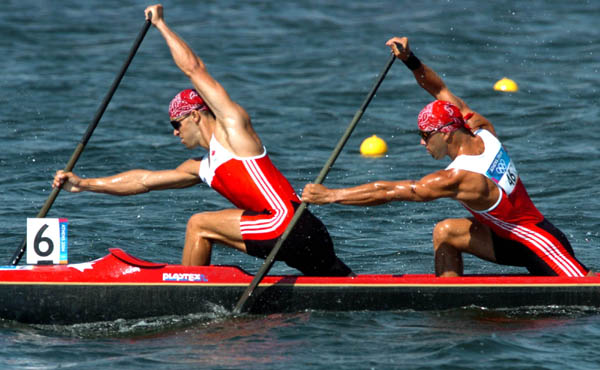 Les canadiens Attila Buday (avant) et Tamas Jr Buday dans le bateau 6  la course de C-2 500 m en ronde prliminaire aux Jeux olympiques d't  Athnes le mardi 24 aot 2004. La paire a termin deuxime dans leur vague de qualification.(CP PHOTO/Andre Forget/COC)
