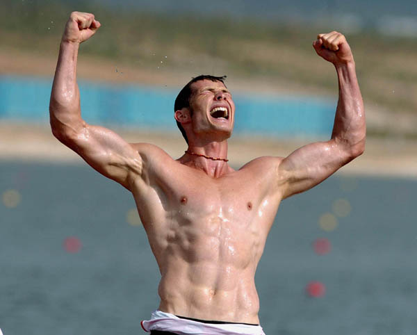 Germany's Tomasz Wylenzek celebrates his teams gold medal win after the C2 1000m final during the Athens 2004 Summer Olympic Games on Friday, August 27, 2004. (CP PHOTO/COC-Andre Forget)