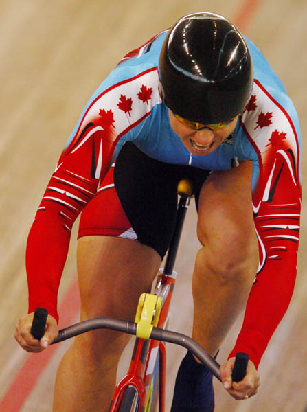 Canadian cyclist Lori-Ann Muenzer of Toronto, Ontario racing during the 500m Time Trial final at the velodrome during the Athens 2004 Summer Olympic Games August 20, 2004. Muenzer posted her personal best and Canadian record for this event with a time of 34.628. (CP PHOTO 2004/Andre Forget/COC)