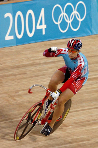 Canada's Lori-Ann Muenzer from  Edmonton celebrates after winning the gold medal in the women's sprint against Russia's Tamilla Abassova at the 2004 Summer Olympic Games in Athens, Greece, Tuesday,  August 24, 2004. (CP PHOTOCOC/Andre Forget)