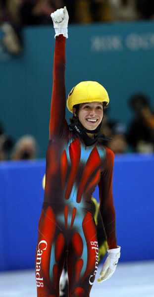 Marie-Eve Drolet, of Laterriere, Quebec, waves to the crowd after her 1000 m at the 2002 Olympic Winter Games in Salt Lake City. (CP Photo/COA/Andre Forget).