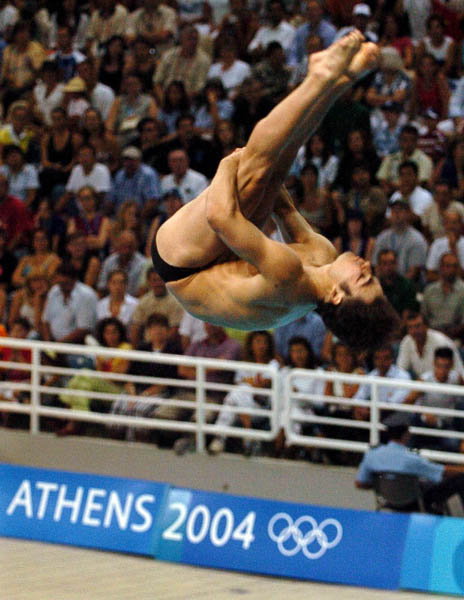 Alexandre Despatie of Montreal performs during the men's 3m springboard event at the 2004 Summer Olympic Games in Athens, Greece, Tuesday,  August 24, 2004. Despatie won the silver medal. (CP PHOTO/COC/Andre Forget)