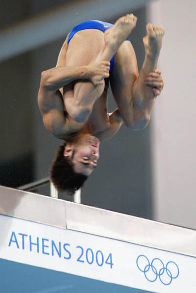 Canada's Alexandre Despatie from Laval, Que. performs a dive in the men's 10m platform finals at the Summer Olympics in Athens Saturday Aug. 28, 2004. Despatie finished fourth in the event won by China's Jia Hu. (CP PHOTO/COC-Mike Ridewood)