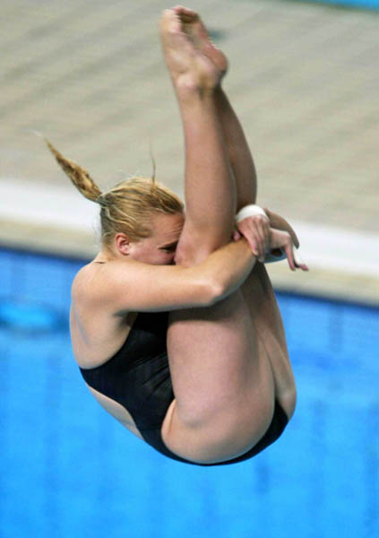 Canada's Blythe Hartley of North Vancouver jumps to a third place in the semifinal and moves on to the final in women's 3 metre springboard diving event at the Summer Olympics in Athens, Greece,, Thursday, August 26, 2004.(CP PHOTO/COC-Mike Ridewood)
