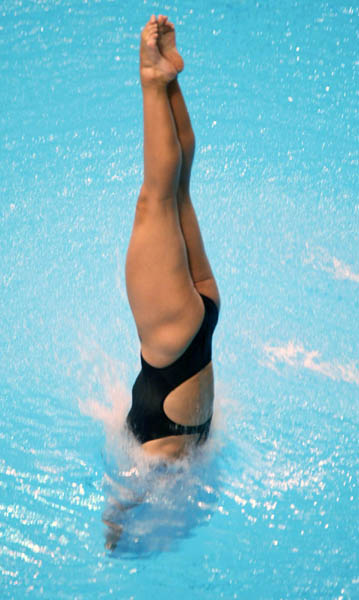 Canada's Emily Heymans of Montreal enters the water on one of her semi-final dives to finish eighth and move on to the final in women's 3 metre springboard diving at the Athens Olympics, Thursday, August 26, 2004.(CP PHOTO)2004(COC-Mike Ridewood)