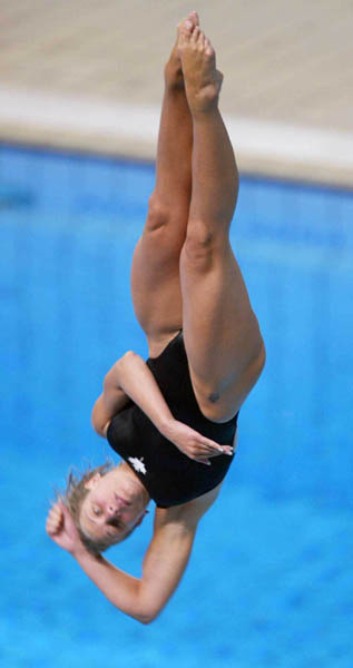 Canada's Emily Heymans of St-Lambert, Que.  jumps to eighth place in the semifinal and moves on to the final in women's 3 metre springboard diving event at the Summer Olympics in Athens, Greece,, Thursday, August 26, 2004.(CP PHOTO/COC-Mike Ridewood)