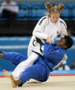 Canada's Amy Cotton, left, from Varennes, Que., battles Italy's Lucia Morico during their second round  -78kg judo competition at the Summer Olympics in Athens Thursday, August 19, 2004. Lucia won the match.  (CP PHOTO/COC-Mike Ridewood)
