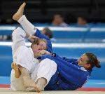Canada's Amy Cotton, left, from Varennes, Que., battles Italy's Lucia Morico during their second round  -78kg judo competition at the Summer Olympics in Athens Thursday, August 19, 2004. Lucia won the match.  (CP PHOTO/COC-Mike Ridewood)