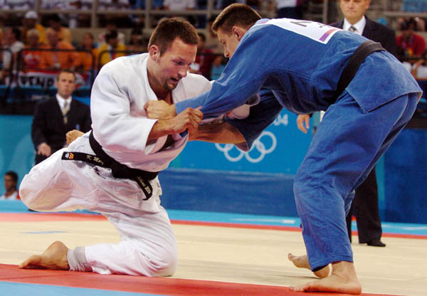 Keith Morgan (left) of Calgary battles Mark Huizinga of the Netherlands during men's 90-kilogram judo competition at the 2004 Summer Olympic Games in Athens, Wednesday, Aug.18, 2004. Morgan did not advance. (CP PHOTO 2004/Andre Forget/COC)