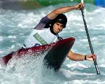 Canadian James Cartwright of Ottawa, Ontario powers through the Canoe/Kayak Slalom course during his C1 event of the Athens 2004 Summer Olympic Games Tuesday August 17, 2004. (CP PHOTO/COC-Andre Forget)