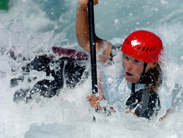 Canadian Margaret Langford of Lions Gate, B.C. powers through the Canoe/Kayak Slalom course during her K1 event of the Athens 2004 Summer Olympic Games Tuesday August 17, 2004. (CP PHOTO/COC-Andre Forget)