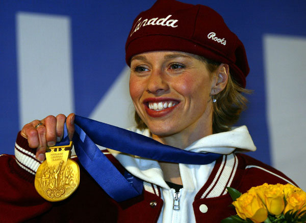 Catriona Le May Doan of Saskatoon celebrates her gold medal run in the women's 500 metre speed skating event at the 2002 Olympic Winter Games in Salt Lake City (CP Photo/COA/Andr Forget).
