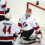 Goalie Martin Brodeur leads his team to a victory over Team USA at the 2002 Olympic Winter Games in Salt Lake City. Team Canada won 5-2 over Team USA.  (CP Photo/COA/Andre Forget).