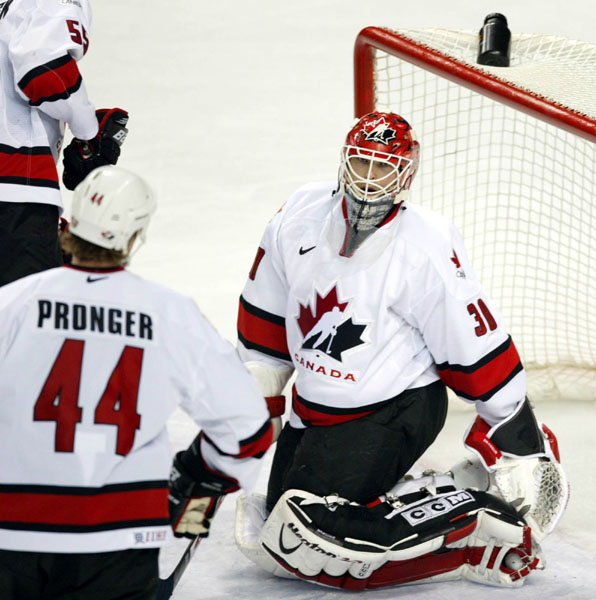 Chris Pronger watches over Team Canada's goalie Martin Brodeur. Team Canada won over Team USA to win the gold medal in hockey Sunday Feb. 24, 2002 at the 2002 Olympic Winter Games in Salt Lake City.  (CP Photo/COA/Mike Ridewood).