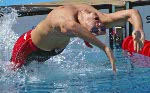 Mike Brown of Perth, Ont. gets off the start and was fourth in preliminaries of the 200 metre breaststroke at the Athens Olympics, Tuesday, August 17, 2004. (CP PHOTO/COC-Mike Ridewood)