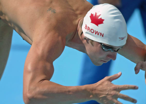 Mike Brown of Perth, Ont. gets off the start and was fourth in preliminaries of the 200 metre breaststroke at the Athens Olympics, Tuesday, August 17, 2004. (CP PHOTO/COC-Mike Ridewood)