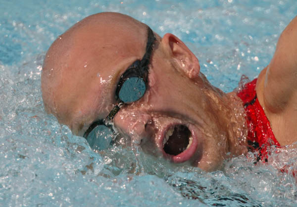 Brian Johns of Richmond, B.C. swims in preliminaries of the 200 metre freestyle relay at the Athens Olympics, Tuesday, August 17, 2004. (CP PHOTO/COC-Mike Ridewood)