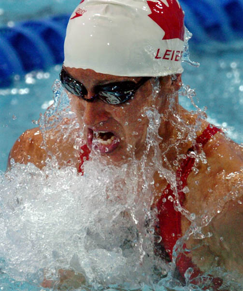 Rhiannon Leier of Canada swims during the Womens 100M Breaststroke during the Athens 2004 Summer Olympic Games Sunday, August 15, 2004. (CP PHOTO/COC-Andre Forget)
