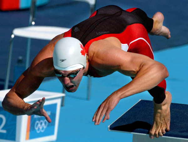 Canada's Matt Rose of Lindsay, Ont. jumps off the starting blocks in his 50-metre freestyle at the 2004 Summer Olympic Games in Athens, Greece, Thursday, August 19, 2004. Rose failed to advance to the next round. (CP PHOTO/COC/Andre Forget)
