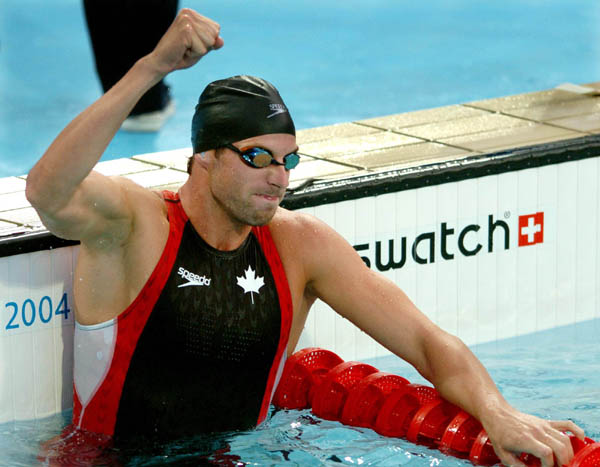 Rick Say of Canada celebrates after qualifying for the Mens 200 M Freestyle during the Athens 2004 Summer Olympic Games Sunday, August 15, 2004. (CP PHOTO/COC-Andre Forget)