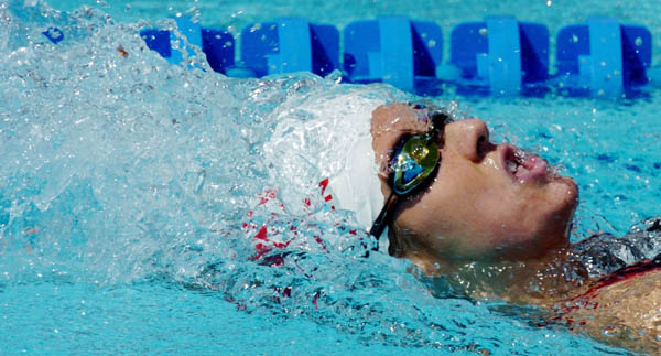 Canada's Elizabeth Warden of Scarborough Ont., swims during her 200-metre backstroke heat at the 2004 Summer Olympic Games in Athens, Greece, Thursday, August 19, 2004. Warden failed to advance to the next round. (CP PHOTO/COC/Andre Forget)