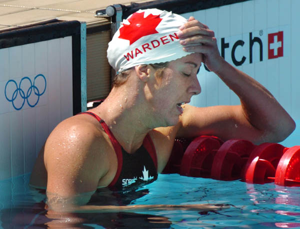 Canada's Elizabeth Warden of Scarborough Ont., reacts after her 200-metre backstroke heat at the 2004 Summer Olympic Games  in Athens, Greece, Thursday, August 19, 2004. Warden failed to advance to the next round. (CP PHOTO/COC/Andre Forget)