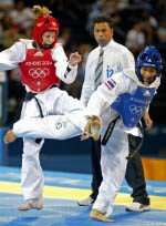 Canada's Ivett Gonda (red) lost to Yaowapa Boorapolchai of Thailand in women's under 49 kg category at the Olympic Games in Athens on Thursday, August 26, 2004. (CP PHOTO)2004(COC-Mike Ridewood)