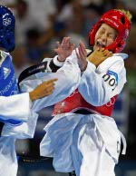 Canada's Ivett Gonda (red) lost to Yaowapa Boorapolchai of Thailand in women's under 49 kg category at the Olympic Games in Athens on Thursday, August 26, 2004. (CP PHOTO)2004(COC-Mike Ridewood)