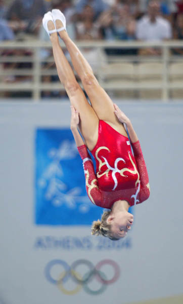 Canada's Karen Cockburn of Toronto jumps to a silver medal in women's trampoline at the Athens Olympics, Friday, August 20, 2004.  (CP PHOTO)2004(COC-Mike Ridewood)