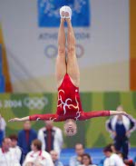 Canada's Karen Cockburn of Toronto jumps to a silver medal in women's trampoline at the Olympic Games in Athens on Friday, August 20, 2004. (CP PHOTO)2004(COC-Mike Ridewood)