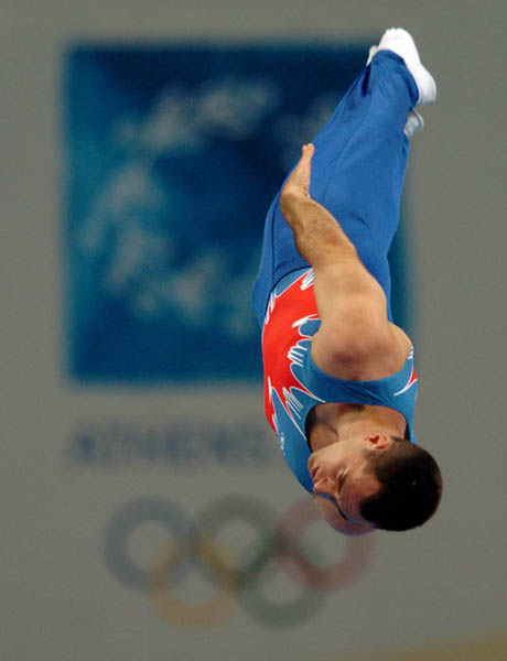 Mathieu Turgeon of Pointe-Claire, Quebec performs during the qualification round of trampoline during the Athens 2004 Summer Olympic Games August 21, 2004. Turgeon did not advance. (CP PHOTO/COC-Andre Forget)