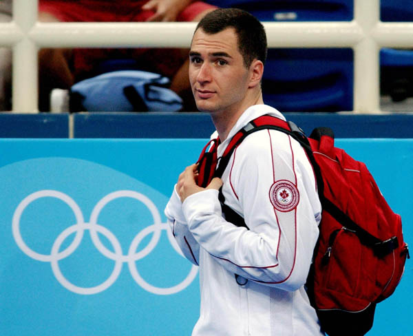 Mathieu Turgeon of Pointe-Claire, Que. heads out after competing in the qualification round of trampoline during the Athens 2004 Summer Olympic Games August 21, 2004. Turgeon did not advance. (CP PHOTO/COC-Andre Forget)