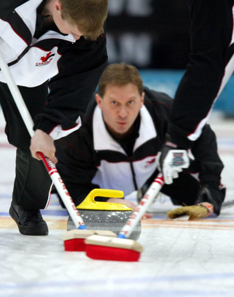 Canadian men's curling third Don Walchuk tries to place his stone during the semi-final against Sweden, 2002 Olympic Winter Games at Ogden, Utah 2002 . (CP PHOTO/COA/Mike Ridewood).