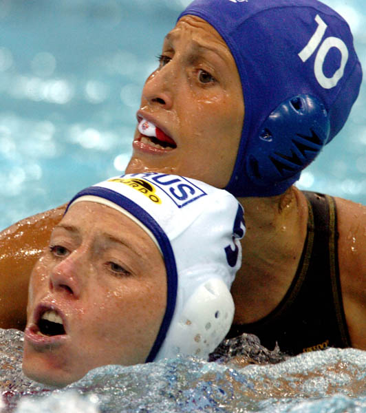 Canadians Jana Salat and Russian Elena Smurova battle for the ball during Waterpolo action during the Athens 2004 Summer Olympic Games August 16, 2004. (CP PHOTO 2004/Andre Forget/COC)