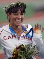 Canada's Chantal Petitclerc of Montreal won the gold medal in women's wheelchair 800 metres in track and field action at the Athens Olympics, Sunday, August 22, 2004.(CP PHOTO/COC-Mike Ridewood)