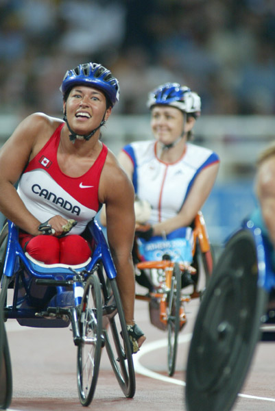 Canada's Chantal Petitclerc of Montreal smiles after winning the gold medal in women's wheelchair 800 metres in track and field action at the Athens Olympics, Sunday, August 22, 2004.(CP PHOTO/COC-Mike Ridewood)