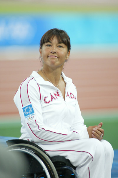 Canada's Chantal Petitclerc of Montreal at the medal ceremony after winning gold in women's wheelchair 800 metres in track and field action at the Athens Olympics, Sunday, August 22, 2004.(CP PHOTO/COC-Mike Ridewood)