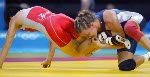 Canada's Lyndsay Belisle (right) of Burnaby, B.C., wrestles Chiharu Icho of Japan in the first match of women's 48kg at the Olympic Games in Athens Sunday, August 22, 2004. Belisle lost the match. (CP PHOTO/COC-Mike Ridewood)