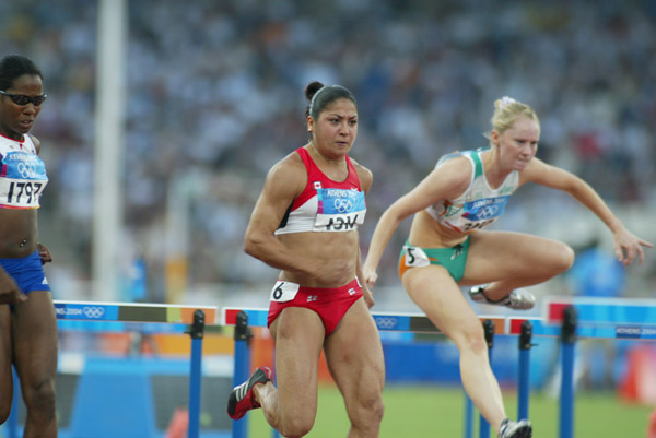 Canada's Priscilla Lopes of Whitby, Ontario, in her heat of women's 100 metre hurdles in track and field action at the Olympic Games in Athens, Sunday, August 22, 2004.  She finished 20th overall in this event. (CP PHOTO)2004(COC-Mike Ridewood)