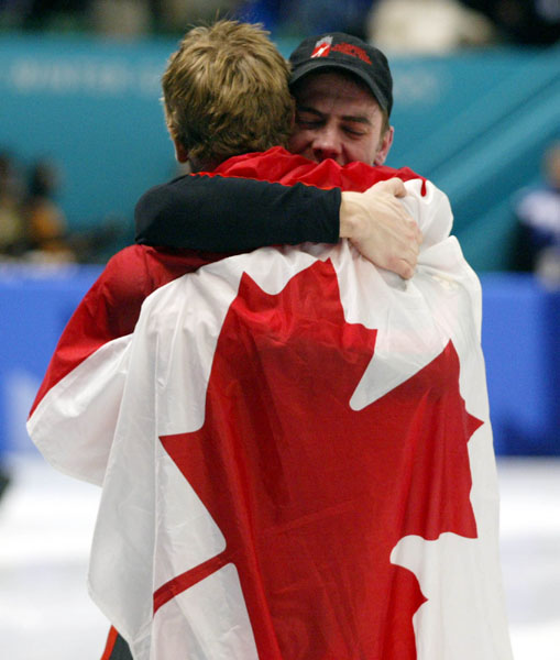 ric Bdard congratulates Franois-Louis Tremblay after their victory in the 5000 m relay at the 2002 Olympic Winter Games. (CP Photo/COA/Andre Forget).