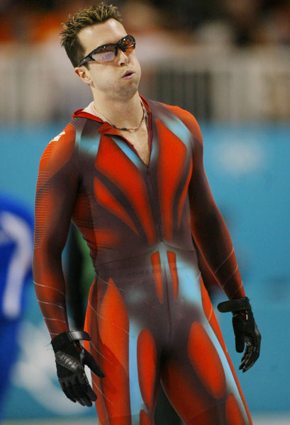 Long-track speed skater Eric Brisson recovers after the 500-metre races in Salt Lake City at the 2002 Olympic Winter Games. (CP Photo/COA/Andre Forget).