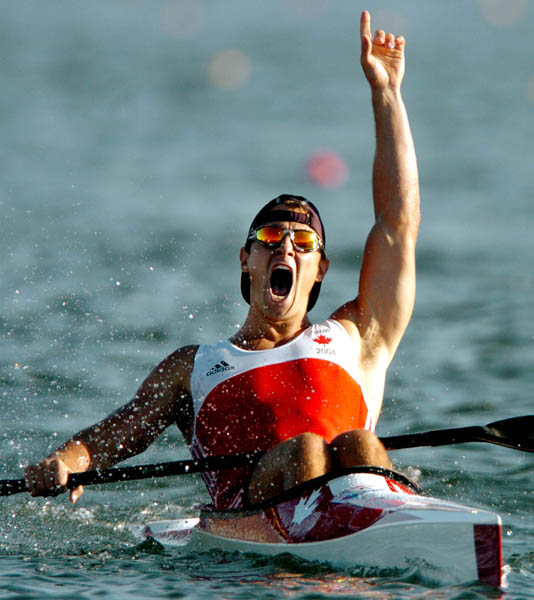 Canada's Adam van Koeverden celebrates his gold medal win during the C1 500m final of the Athens 2004 Summer Olympic Games Saturday, August 28, 2004. (CP PHOTO/COC-Andre Forget)