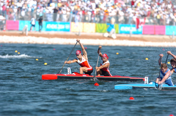Canada's Attila Buday (front) and Tamas Jr. Buday race in boat 3 in the C2 500m final at the Athens 2004 Summer Olympic Games Saturday August 28, 2004. The pair finished eighth overall. (CP PHOTO/COC-Andre Forget)