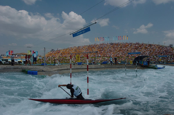 Canadian James Cartwright of Ottawa, Ontario powers through the Canoe/Kayak Slalom course during his C1 event of the Athens 2004 Summer Olympic Games Tuesday August 17, 2004. (CP PHOTO/COC-Andre Forget)